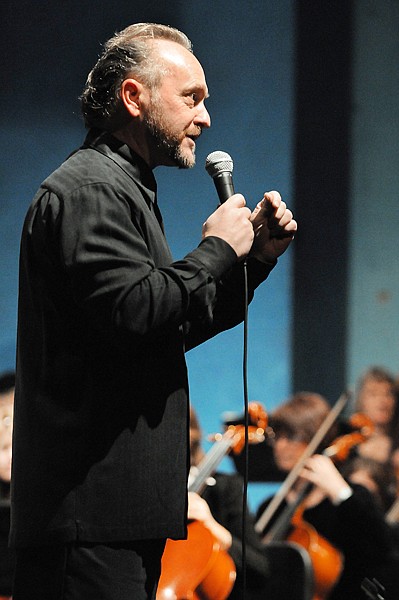 Glacier Symphony and Chorale Music Director John Zoltek speaks to students about what they will hear and what they should be listening for as the symphony prepares to play a piece by Brahms.