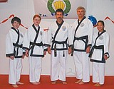 Four promoted to first-degree black belt