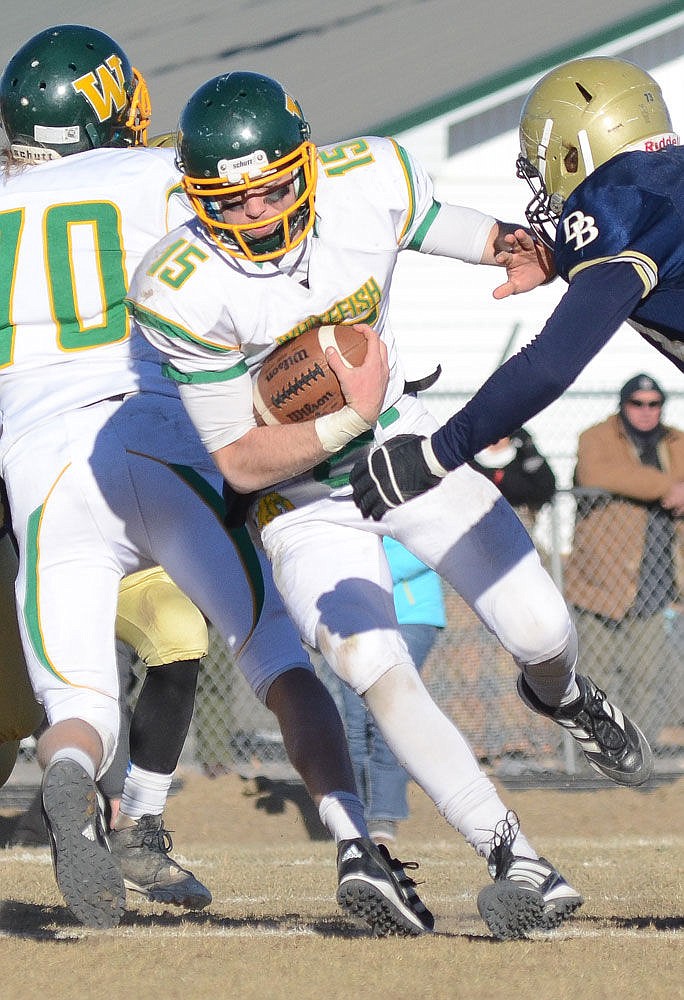 <p>Whitefish senior quarterback Luke May picks up a first down in the second half of the State A championship game at Dillon on Nov. 21, 2015. (Matt Baldwin/Whitefish Pilot)</p>