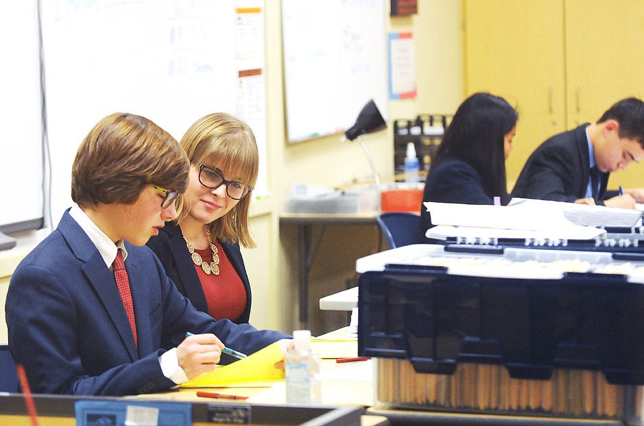 &lt;p&gt;&lt;strong&gt;Glacier&lt;/strong&gt;'s Harrison Rennie, left, and Kelsie Davis go over notes during their varsity policy debate at Glacier High School during the first day of the Western Regional Speech and Debate Tournament on Friday. (Aaric Bryan/Daily Inter Lake)&lt;/p&gt;