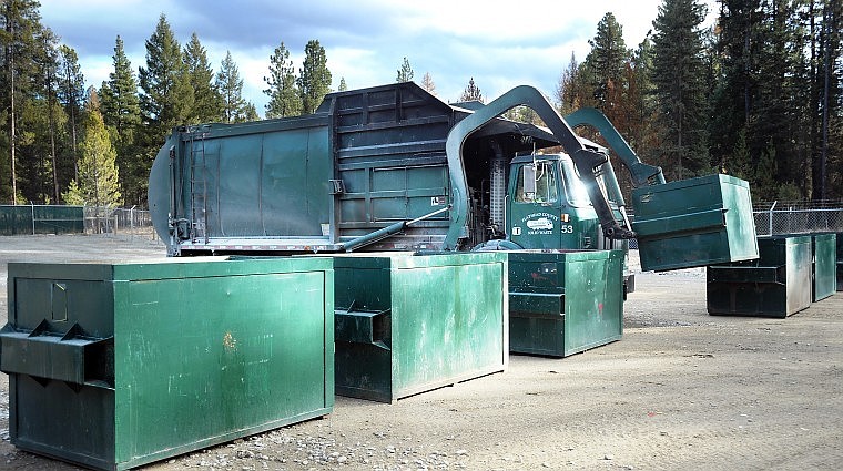 Boxes being arranged on Wednesday at the opening of the new Ashley Lake Road green-box site off U.S. 2.