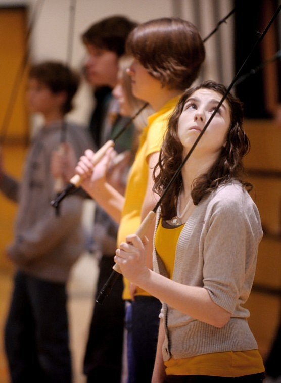 Kimmerly Lyford and other eighth-graders at Kalispell Middle School work on their fly fishing technique on Thursday in physical education class with teacher Noah Couser.