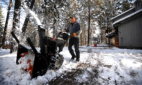 &lt;p&gt;Ron Clark of Lakeside uses a snowblower to clear his driveway on
Monday morning.&lt;/p&gt;