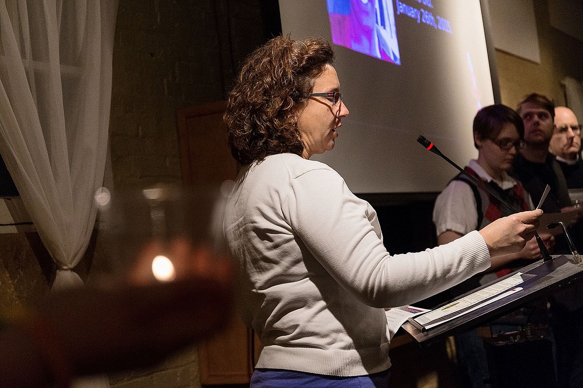 &lt;p&gt;Heather Seman, pastor of Community United Methodist Church in Coeur d&#146;Alene, reads the story during a candle light vigil&#160;of a transgender person who was murdered.&lt;/p&gt;