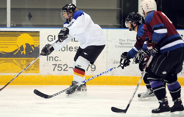 Cody McCarthy (60) gets enough of a lead to take a shot during the C League game on Tuesday, November 16, at the Stumptown Ice Den.