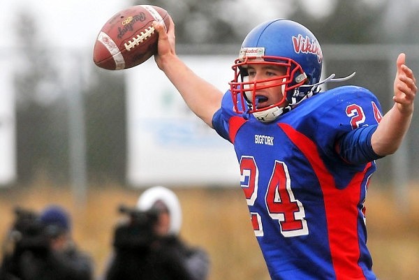 Bigfork's Travis Knoll (24) holds the ball from his game winning catch in the end zone. The Vikings scored on fourth down with eight seconds to go in the game, taking the Class B Championship game 24-21.