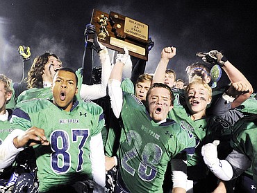 <p>The Glacier Wolfpack celebrate their 56-19 victory against the CMR Rustlers in the AA State Championship in Kalispell on Friday. (Aaric Bryan/Daily Inter Lake)</p>