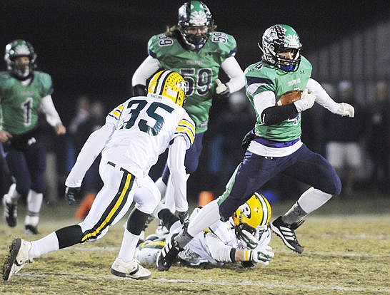 &lt;p&gt;Glacier's Thomas Trefney breaks a tackle during the first quarter. (Aaric Bryan/Daily Inter Lake)&lt;/p&gt;