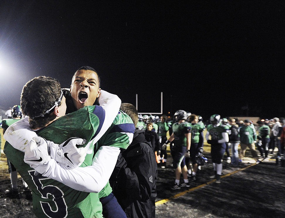 &lt;p&gt;Devin Cochran (5) and Jacob Janke (87) embrace during the fourth quarter of the Wolfpack's 56-19 victory in the AA State Championship. (Aaric Bryan/Daily Inter Lake)&lt;/p&gt;