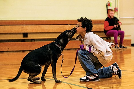 &lt;p&gt;Curtiss Lockett, 12, gets a kiss from Monte during a graduation ceremony of participants of the Pawsitive Works program Thursday at Mountain View Alternative High School in Rathdrum.&lt;/p&gt;