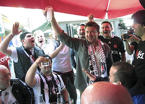 &lt;p&gt;Jack Maxwell, center, is shown toasting Raki, a local drink, with rebel football fan club Carsi in the neighborhood of Besiktas in Istanbul, Turkey, April 17. Maxwell, of Boston, will host &quot;Booze Traveler,&quot; where he explores places, customs and cultures behind drinks around the globe. The program debuts Sunday, Nov. 24 on the Travel Channel.&lt;/p&gt;