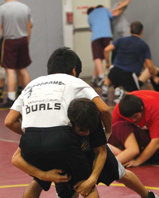 Moses Lake wrestlers practice takedowns.