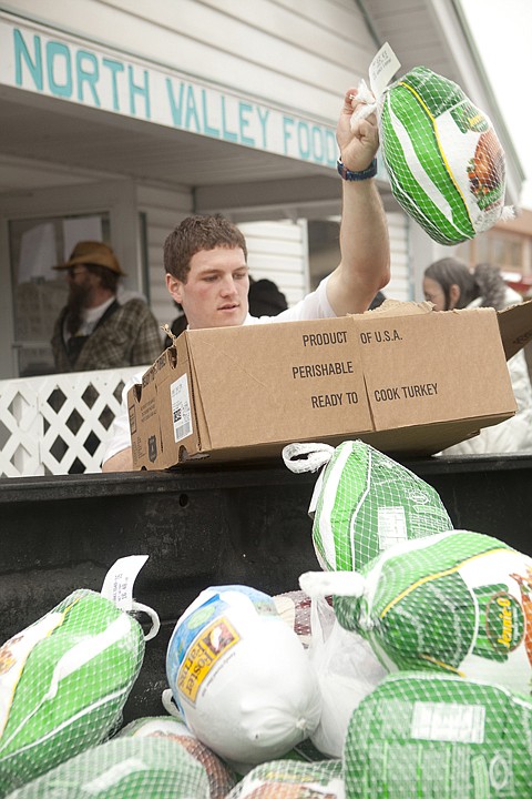 &lt;p&gt;Volunteer Elder Mudge unloads donated turkeys into the back of a
pickup truck Tuesday afternoon at the North Valley Food Bank in
Whitefish.&lt;/p&gt;