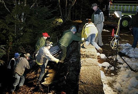 Flathead County Search and Rescue and Park &lt;br&gt;Service responders carry the body of an unidentified man to the McDonald Creek platform pullout. Flathead County dive-team members entered the icy water below the platform pullout on &lt;br&gt;Upper McDonald Creek, just off the Going-to-the-Sun Road.&lt;br&gt;Divers recover man&#146;s body from McDonald Falls Craig Moore/ Daily Inter Lake