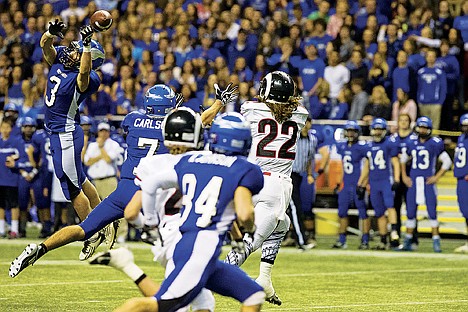 &lt;p&gt;Coeur d'Alene's Jonny Plum (3) breaks up a pass in the first quarter of the State 5A football championship game Friday against Highland at the University of Idaho Kibbee Dome in Moscow.&lt;/p&gt;