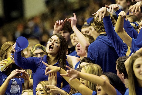 &lt;p&gt;Coeur d'Alene High senior Cami Egan cheer with the student section Friday at the Kibbee Dome.&lt;/p&gt;