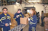 Navy recruiters help load up Thanksgiving meals