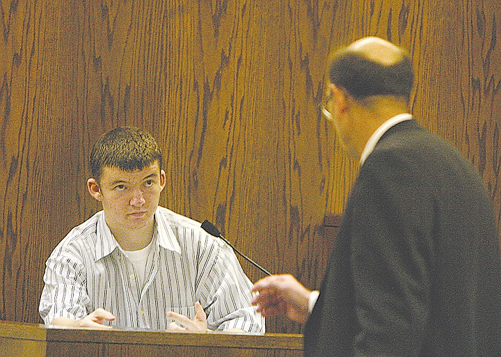 Evan Savoie gestures while answering questions from Grant County
Prosecutor John Knodell in Grant County Superior Court. Savoie took
the stand Wednesday as one of the final witnesses in his
first-degree murder trial.