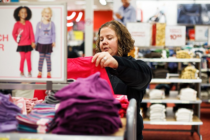 &lt;p&gt;SHAWN GUST/Press Amanda Nicholson checks out clothing items Monday while shopping at Target in Coeur d'Alene. Nicholson says she plans to shop Black Friday sales in the area.&lt;/p&gt;
