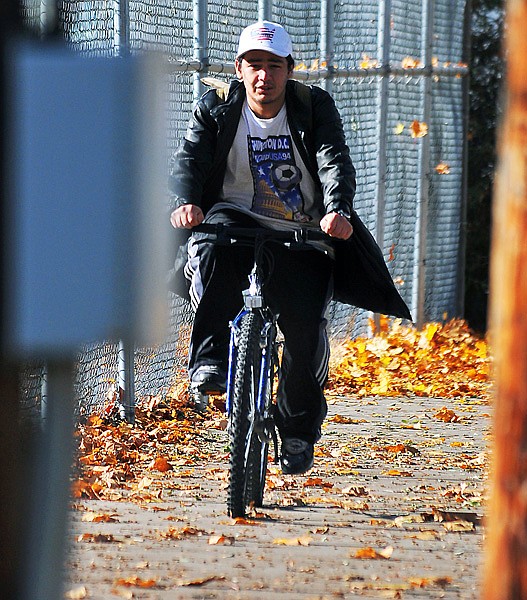 Chris rides his bike to school at Bridge Academy.