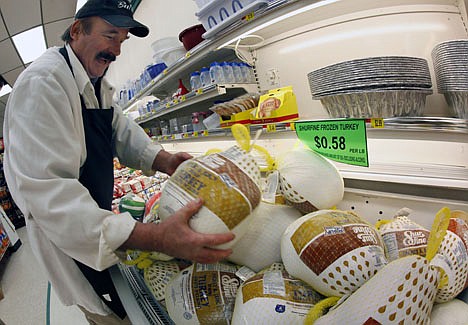 &lt;p&gt;Dennis Sheehan, meat manager, stocks turkeys at Pixley's Shurfine grocery store in Akron, N.Y., Tuesday, Nov. 22, 2011. (AP Photo/David Duprey)&lt;/p&gt;