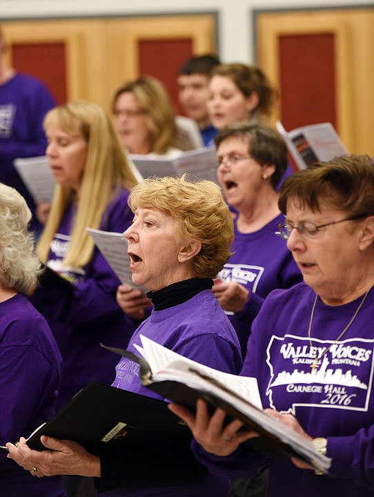 <p>Anne Mahoney and members of the Valley Voices rehearsing on Monday evening, November 21, at Flathead High School in Kalispell. (Brenda Ahearn/Daily Inter Lake)</p>