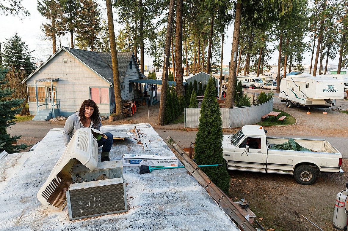 &lt;p&gt;&#160;Dondie Pierpont, assistant manager at Tamarack RV Resort, works to seal the top of her trailer before the snow falls. Pierpont&#146;s home was among those damaged in the storm.&lt;/p&gt;