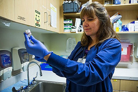 &lt;p&gt;Colleen Zwiers, a nurse at Kootenai Health, draws insulin during her shift on Monday afternoon. Payrolls increased $23.5 million in 2013 compared with 2012 in the health care and social assistance sector of Kootenai County&#146;s economy.&lt;/p&gt;