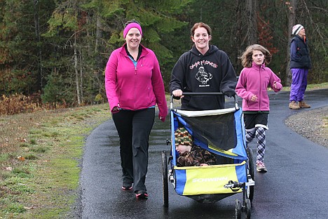 &lt;p&gt;Vanessa Burt and Casey Figueroa push Aiden Figueroa while Saror Figueroa chases in the background at Thursday morning's Turkey Trot. More than 100 runners participated in the annual fun run at the Enaville Resort in Kingston. When the event began more than 20 years ago, between eight and 12 runners participated.&lt;/p&gt;