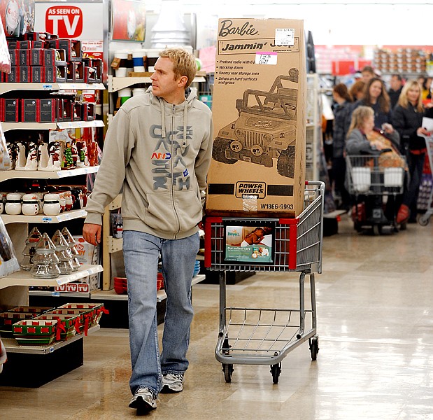 &lt;p&gt;Griff Price of Lethbridge, Alberta, looks intently down the
aisles as he makes his way through Kmart in Evergreen early
Friday.&lt;/p&gt;