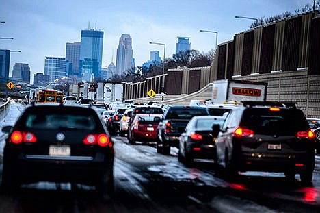 &lt;p&gt;In this Nov. 10 photo, traffic crawls into downtown Minneapolis, Minn from the south along I-35W as an early snow was compressed into a slippery mess. Minnesota motorists can expect more company on the roads around Thanksgiving due to low gas prices and an improving economy.&lt;/p&gt;