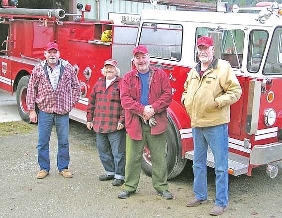 Courtesy Photo The Bull Lake Fire District recently acquired a Type 2 fire engine from Fisher River Valley. From left, Bruce Edwards, Robert Morck, Mike Casey and Harry Pearson.