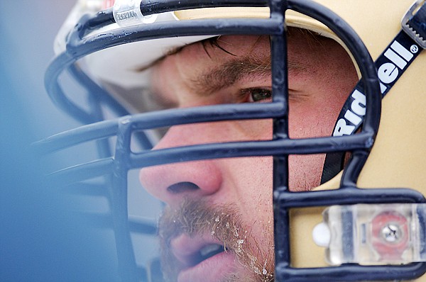 Bobcat defensive tackle Dan Ogden (90), formerly of Kalispell, endures the cold as he watches and waits to take the field for the first time in the 110th Brawl of the Wild on Saturday, November 20, in Missoula. The Cat/Griz game was the coldest of the year.