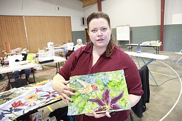 &lt;p&gt;Monique Kleinhans shares some of her work during a thread painting demonstration.&lt;/p&gt;