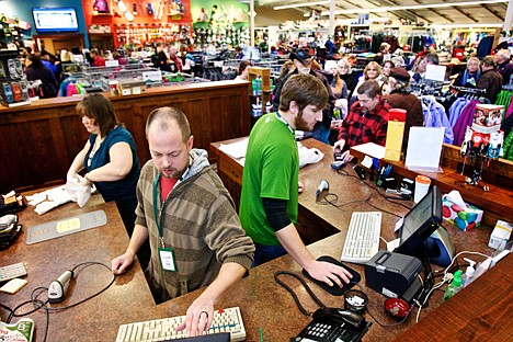 &lt;p&gt;Nick Martin, left, and Marshall Barnhouse ring up customers within minutes of Tri-State Outfitter's Black Friday opening at 8 a.m. where hundreds of shoppers lined up around the Coeur d'Alene storefront.&lt;/p&gt;