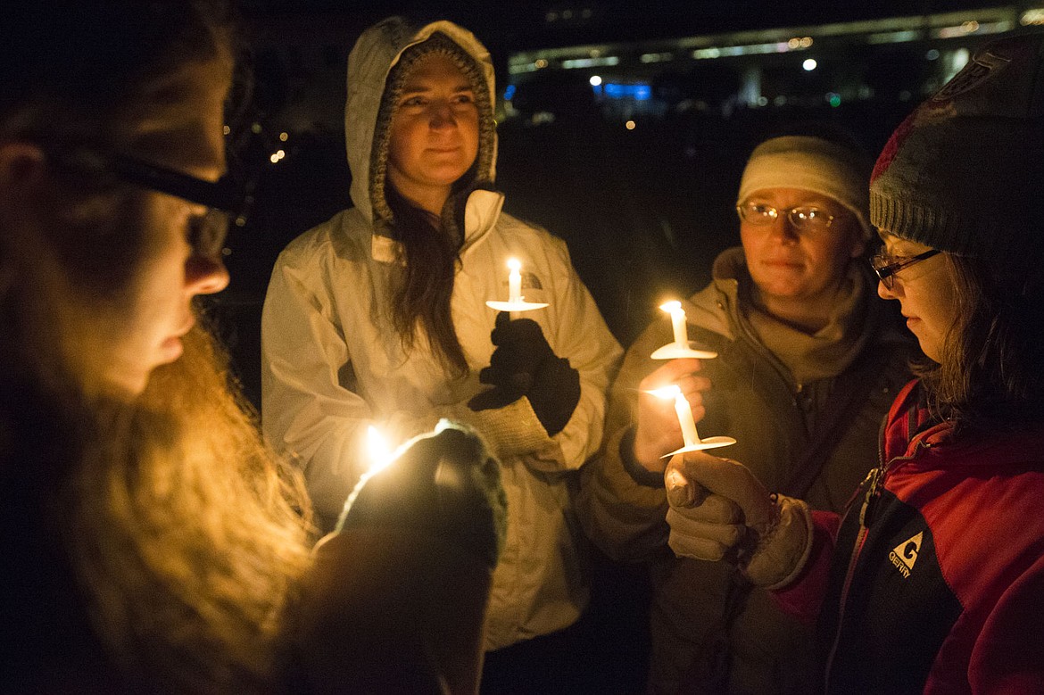 &lt;p&gt;The Perry family, from Coeur d'Alene, hold holiday candles as they wait for the Coeur d'Alene Resort Holiday Lights Show firework display Friday night.&lt;/p&gt;