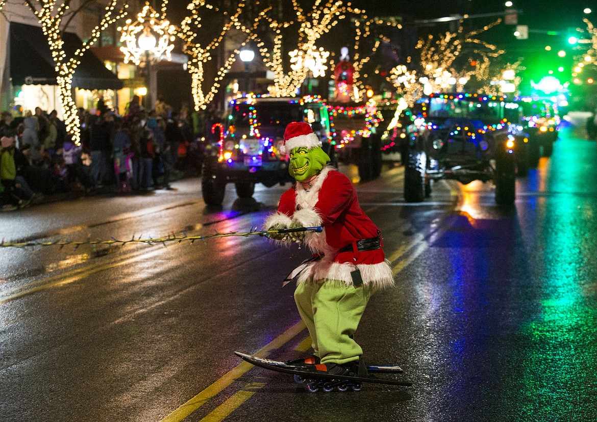 &lt;p&gt;The Grinch skis down the holiday parade route Friday night in downtown Coeur d'Alene.&lt;/p&gt;