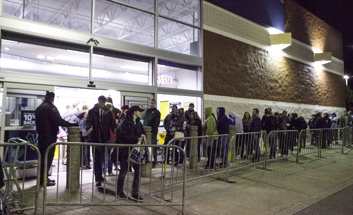 &lt;p&gt;Shoppers funnel into Best Buy in Coeur d&#146;Alene Thursday night as they watch those who were before them in line exit with goods in hand. Discounts on electronics, oftentime &#147;ticketed&#148; and sold on a first-come, first-served basis, encouraged many to cut their turkey day short and brave the crowds.&lt;/p&gt;