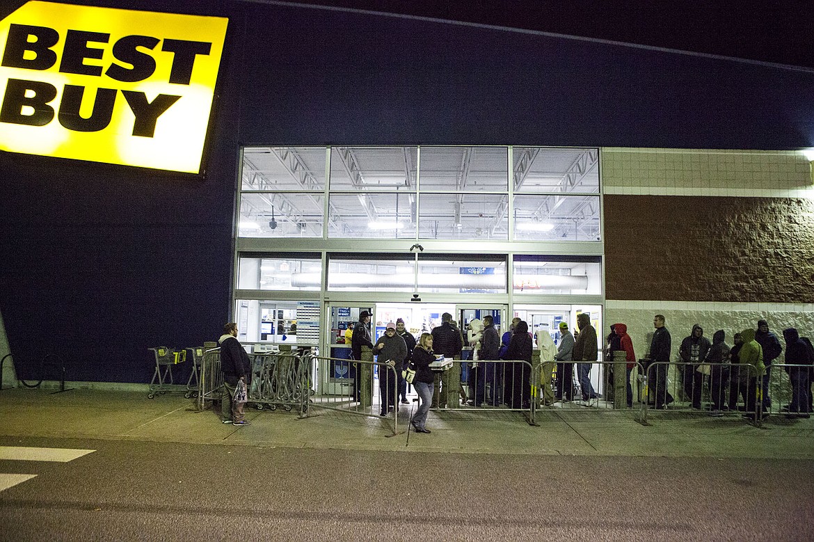 &lt;p&gt;Shoppers funnel into Best Buy in Coeur d'Alene Thursday night as they watch those who were before them in line exit with goods in hands. Discounts on electronics, oftentime &quot;ticketed&quot; and sold on a first come first serve basis, encouraged many to cut their turkey day short and brave the elements.&lt;/p&gt;