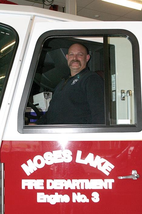 Candice Boutilier/Columbia Basin HeraldMoses Lake Fire Department Assistant Fire Chief Brett Bastian was honored for more than 15 years of service to the city.
