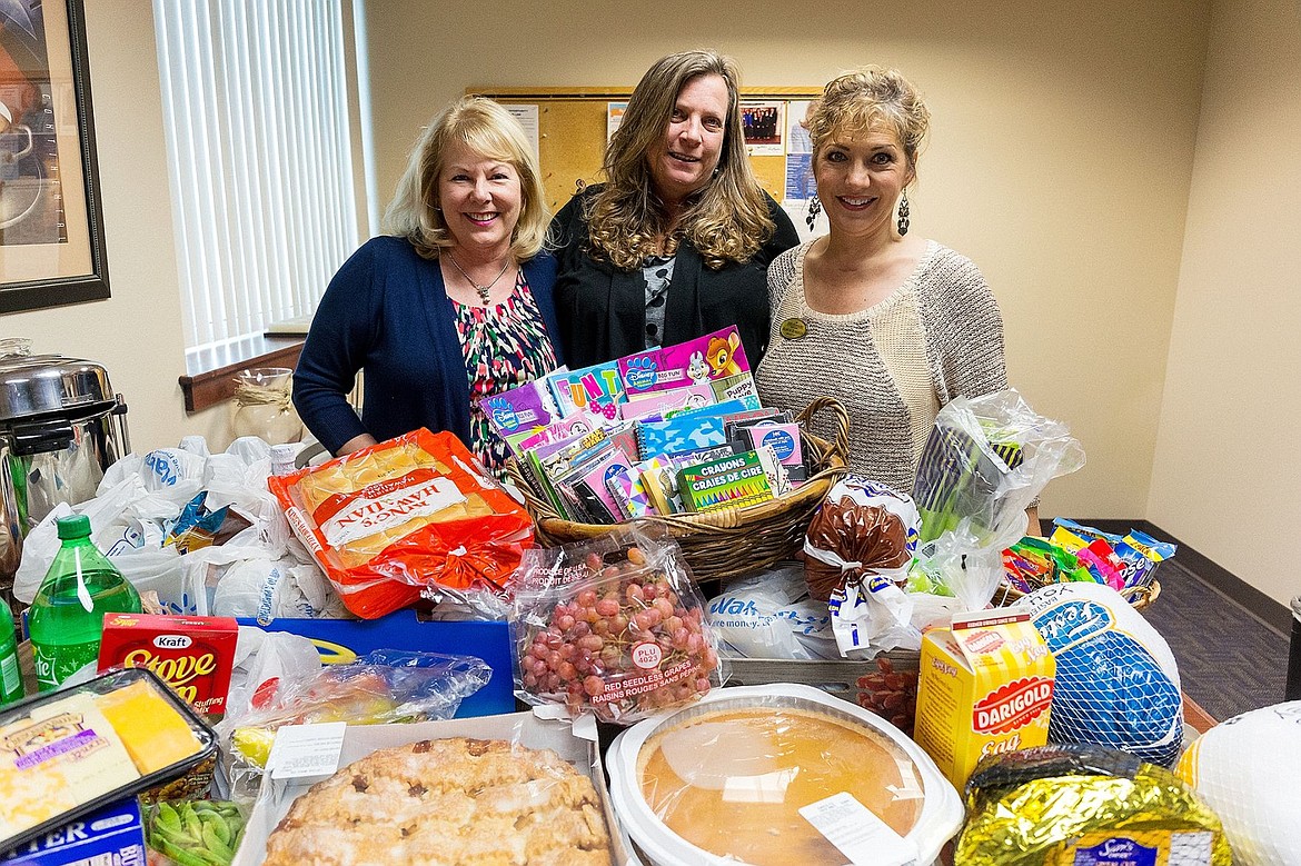 &lt;p&gt;In addition to the Windermere Foundation&#146;s Boots and Socks Program, employee contributions and fundraising collected dozens of items for the Safe Passage women&#146;s shelter. From left, Midge Smock, Cindy Perry and Alison Roberts.&lt;/p&gt;