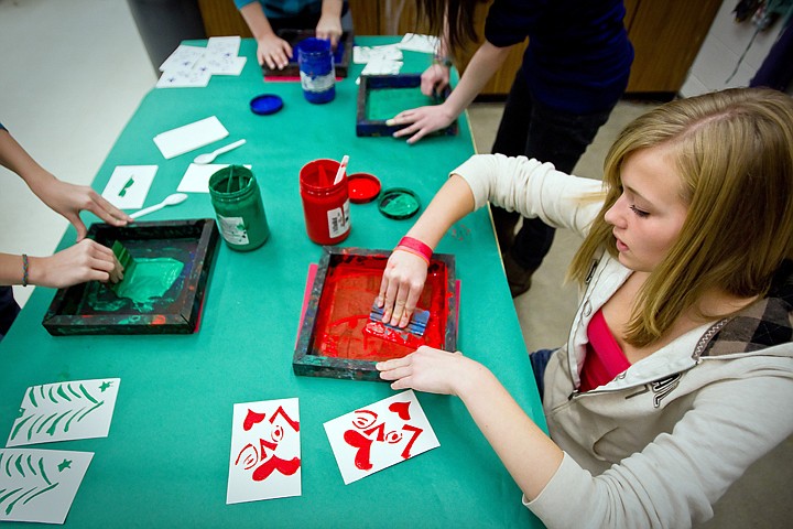 &lt;p&gt;JEROME A. POLLOS/Press Whitney Kane, 13, presses ink onto a card Monday during Alli Graham's art class at Canfield Middle School. Graham's students are crafting about 200 screen printed holiday cards for the American Red Cross fourth annual Holiday Mail for Heroes which will send the cards to Idaho soldiers and their families.&lt;/p&gt;