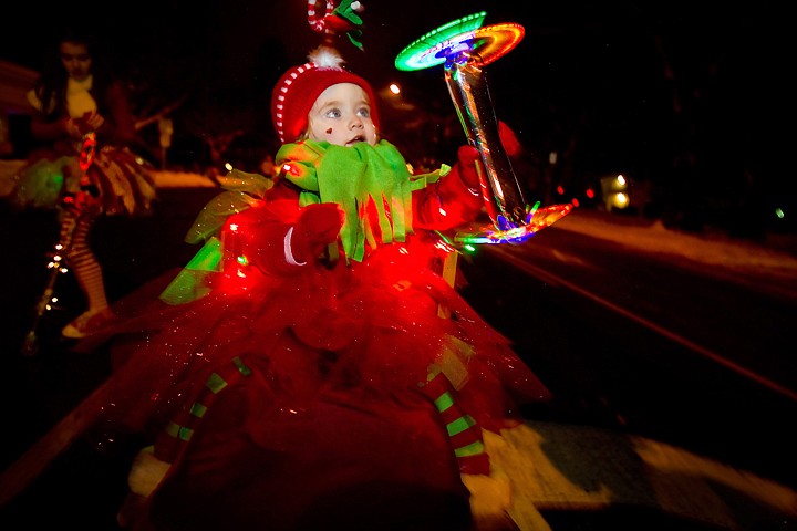 &lt;p&gt;Ruby Krajic, 2, shows off her light display as she is pulled along the parade route on a sled secured to a wagon.&lt;/p&gt;