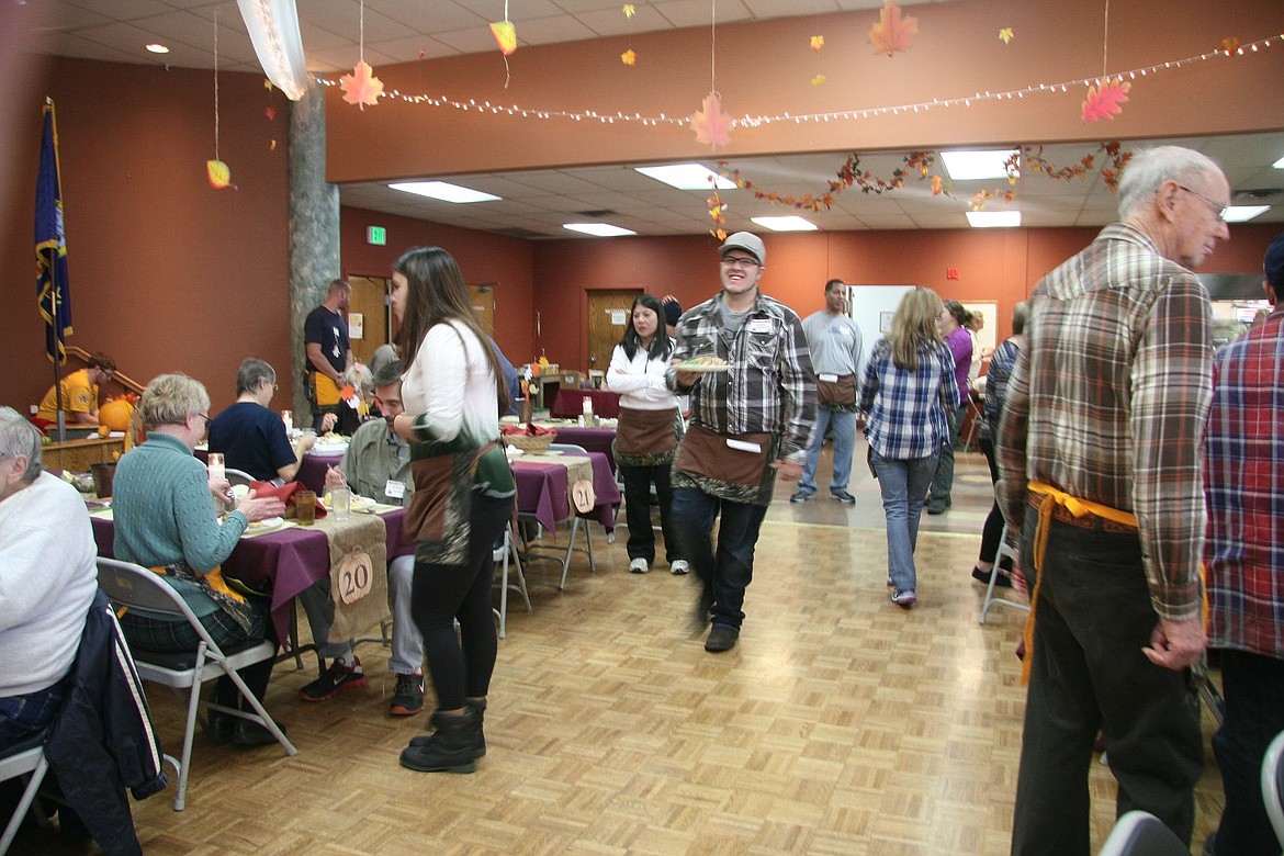 &lt;p&gt;Logan Crossley, 20, of Coeur d&#146;Alene, right, races plates to guests during the free community Thanksgiving day meal at Lake City Center Thursday. &#147;We just have so much food to give,&#148; he said. &#147;To see their reactions is a great gift.&#148;&lt;/p&gt;