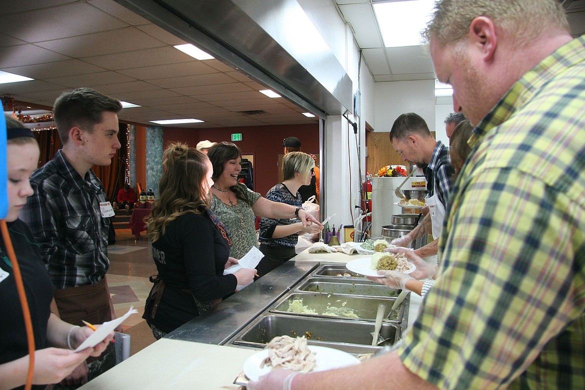 &lt;p&gt;Vickie Hillicoss points to delicious sweet potatoes as she and her volunteers line up to serve guests a Thanksgiving meal at the Lake City Center Thursday. More than 100 pies, 51 turkeys and an abundance of side dishes were served throughout the two-hour event.&lt;/p&gt;