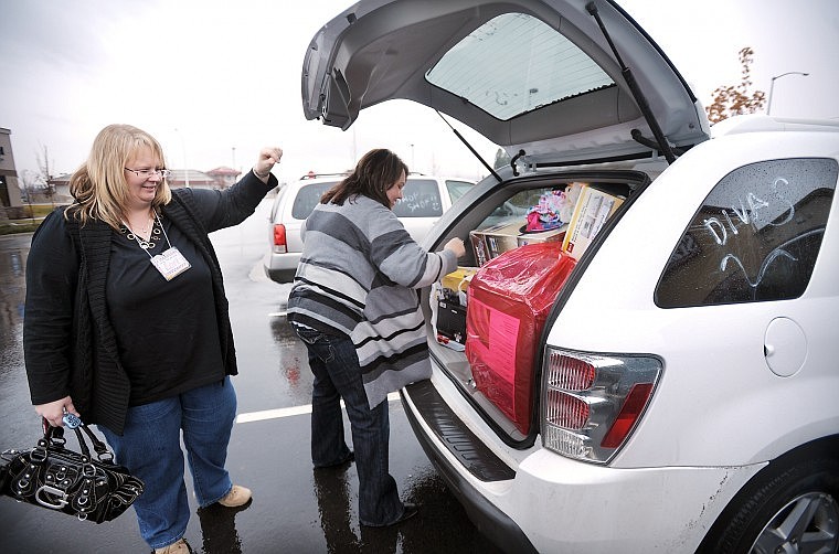 Lori Rolfe of Coutts, Alberta, and Jill Rowland of Claresholm, Alberta, take inventory of their purchases Friday morning before taking a break for brunch. After the break they headed back to the Duck Inn in Whitefish, unloaded their vehicle and resumed shopping.