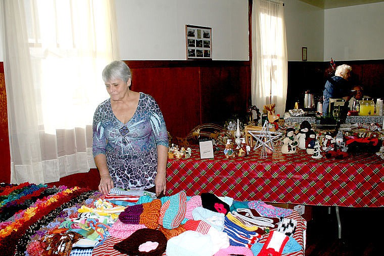 &lt;p&gt;Anita Parkin looks over a selection of knitting during the Holiday Bazaar organized by Superior's United Methodist Church. While the bazaar was a fundraiser for the Methodist church, the entire community donated items.&lt;/p&gt;