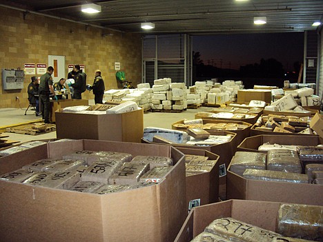 &lt;p&gt;Packages of seized marijuana are examined by officials in Murrieta, Calif., after a cross-border tunnel between Tijuana, Mexico and San Diego was discovered. U.S. authorities said Friday that they seized tons of marijuana in connection with a tunnel that was equipped with a rail car - the second discovery of a major underground drug passage in San Diego this month.&lt;/p&gt;