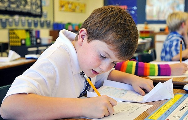 Zane Von Heeder drafts his letter back to his pen pal in China.