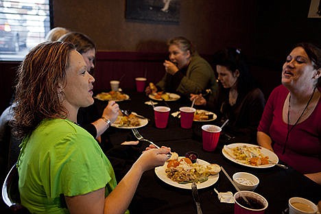 &lt;p&gt;Victoria Magistrale and Lasca Pulley share a laugh at The Fedora Pub and Grille on Thursday afternoon during the restaurant&#146;s annual community Thanksgiving dinner. Magistrale and Pulley, along with an estimated 1,500 other residents of the community, were treated to a traditional Thanksgiving meal free of charge.&lt;/p&gt;